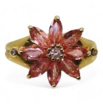 An 18ct gold pink sapphire and diamond flower ring, size O, weight 6.1gms Condition Report:Available