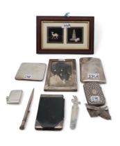 A collection of silver including and white metal, including a silver vesta, a silver and leather