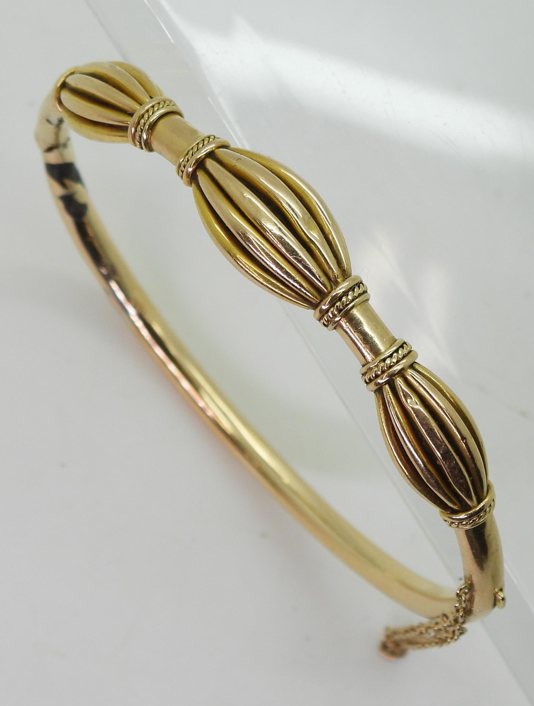 A yellow metal bangle, with oval pleated bead design (af) diameter 6.2cm, weight 12gms Condition - Image 2 of 4