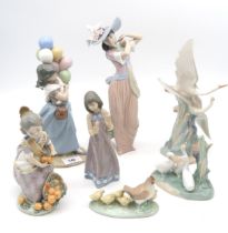 A collection of Lladro and Nao figures of girls and birds including a Sad Clown head, all with boxes