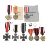 A collection of German military medals, comprising Third Reich West Wall Medal, retaining issue