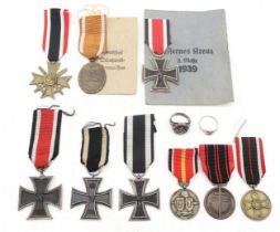 A collection of German military medals, comprising Third Reich West Wall Medal, retaining issue