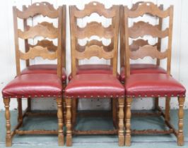 A set of six 20th century oak leather upholstered dining chairs with fret cut laddered backs on