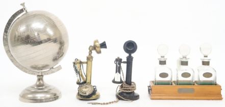 A lot comprising a 20th century brass "conversation pieces" candlestick rotary telephone, another