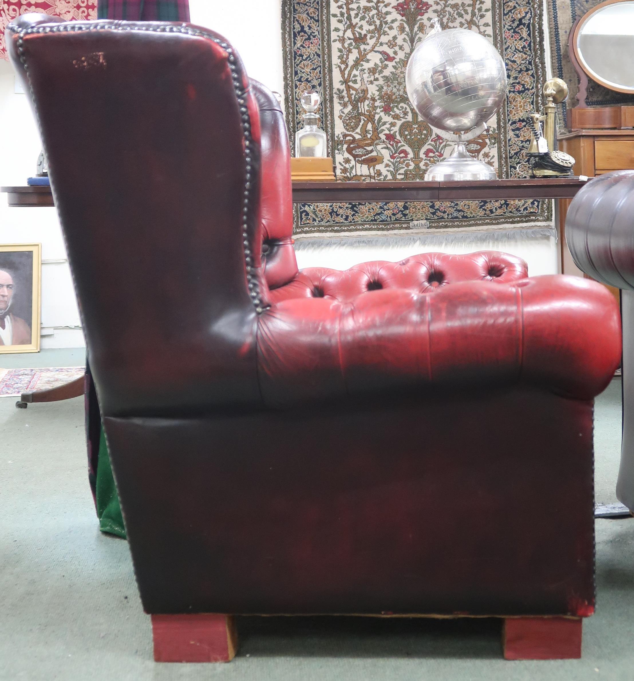 A 20th century oxblood buttonback leather upholstered Chesterfield style wingback armchair, 97cm - Image 2 of 2