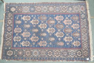 A blue ground Turkish nomadic style rug with all over geometric patterned ground within