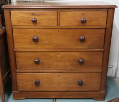 A 20th century beech two over three chest of drawers on plinth base with turned handles, 100cm