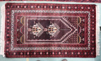 A rich multicoloured ground fine handwoven Afghan Baluch nomadic rug with geometric prayer style