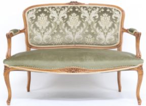 A 20th century reproduction continental style parlour settee with floral damask upholstered back