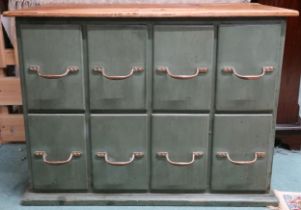 A contemporary pine topped green painted eight drawer chest, 60cm high x 81cm wide x 49cm deep
