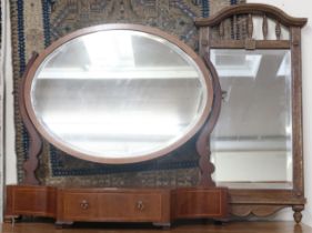 A Victorian mahogany framed oval bevelled glass toilet mirror with serpentine front single drawer