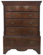 A GEORGIAN WALNUT CHEST ON CHEST  with moulded cornice over four long drawers flanked by reeded