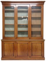 A VICTORIAN MAHOGANY LIBRARY BOOKCASE  with moulded cornice over three glazed doors on base with