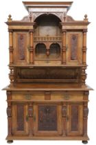 A 19TH CENTURY CONTINENTAL MAHOGANY AND WALNUT VENEERED SIDEBOARD  stepped superstructure with