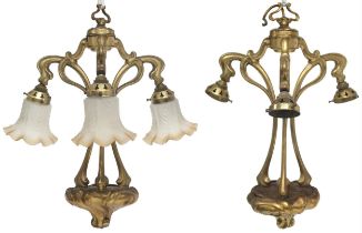 A PAIR OF 20TH CENTURY BRASS ART NOUVEAU STYLE THREE BRANCH CHANDELIERS (lacking three of the