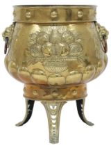 A DUTCH BRASS PLANTER  with bulbous body embossed with armorial crest to one side and fruit/