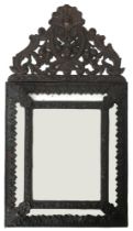 A 19TH CENTURY DUTCH CUSHION FRAMED WALL MIRROR  with repousse metal frame modelled as fruit and