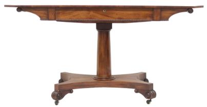 A GEORGE IV MAHOGANY LIBRARY TABLE  with octagonal top over single frieze drawer on cylindrical