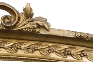 A LATE 19TH CENTURY GILT GESSO ROCOCO STYLE OVERMANTLE MIRROR with scrolled surmount over arched