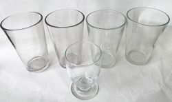 A pair of GWR half pint glasses, each etched with the Hotels roundel logo on the side. Together with