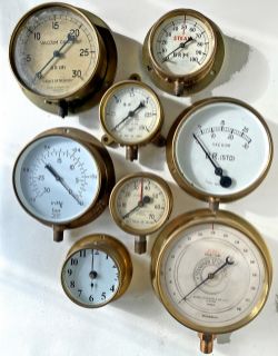 Brass cased Pressure Gauges to include x4 BR and x3 others plus a brass cased electric clock which