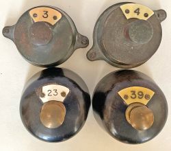 A pair of brass Plungers, one having a plate No 4, the other a plate No 3. Together with a pair of