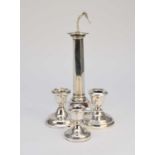 A silver mounted lamp base and three candlesticks