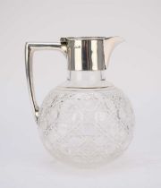 An Edwardian silver mounted claret jug