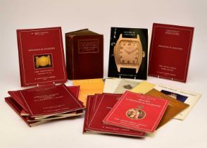 A collection of watch related auction catalogues and a horological book