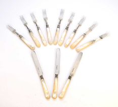 A part set of mother of pearl handled silver knives and forks