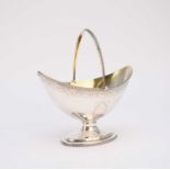 A George III silver swing handled sugar basket