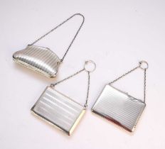 Two silver card cases and a silver purse