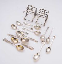 A pair of golfing interest silver toast racks and silver spoons