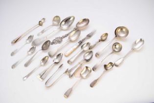 A collection of various pieces of silver and white metal flatware