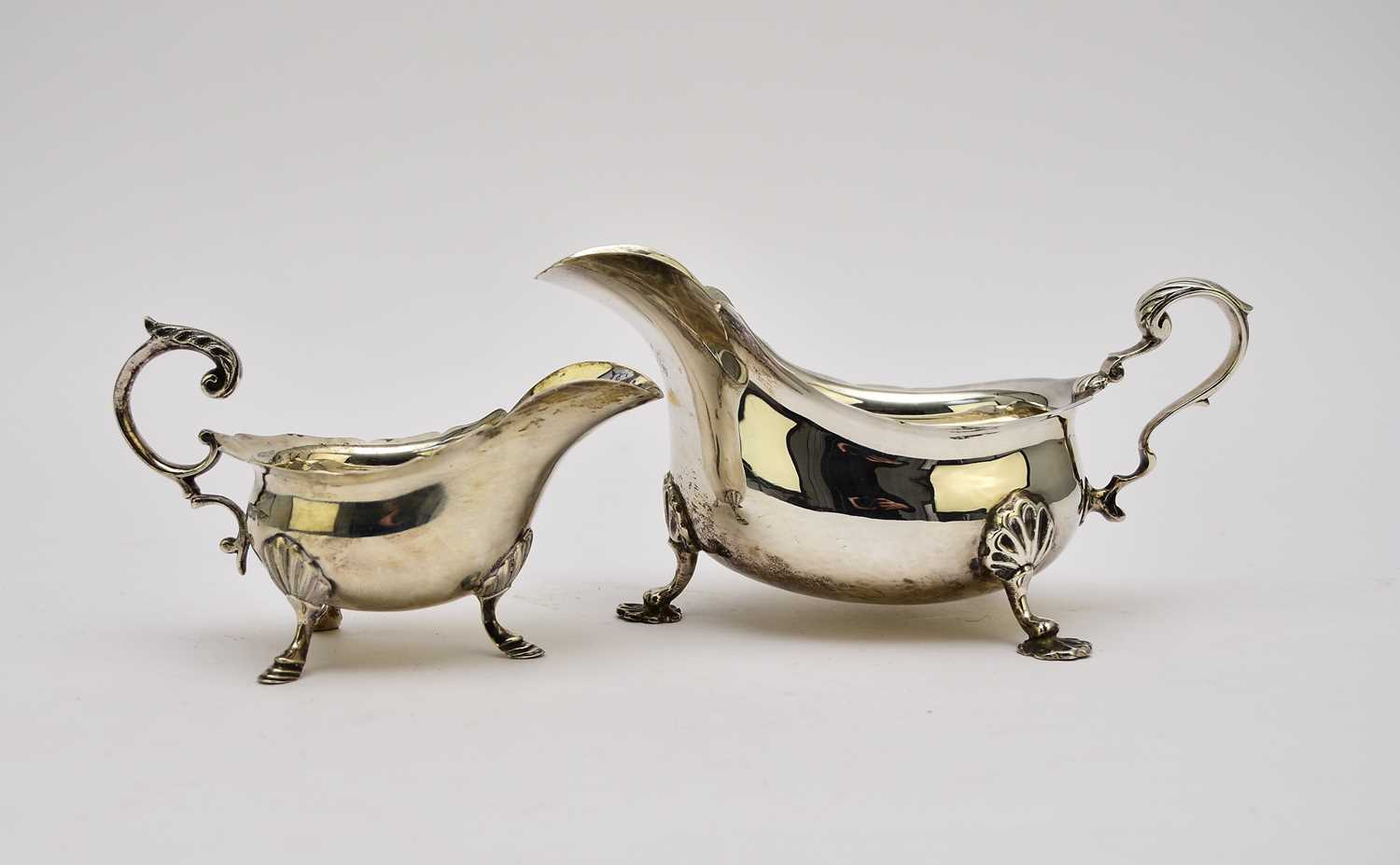 Two silver sauce boats