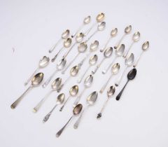 A collection of various silver spoons