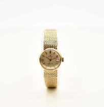 Omega: A lady's 9ct gold Ladymatic bracelet watch
