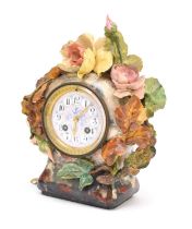 A French earthenware-cased mantel clock