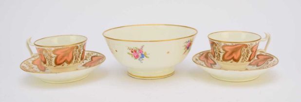 A pair of Swansea porcelain teacups with saucers and a Swansea bowl