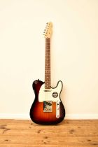 An American Fender Telecaster electric guitar with Fender fitted case