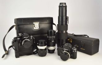 A collection of roll film cameras, lenses and accessories