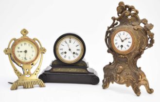 Two brass-mounted mantel clocks and an ebonised mantel clock