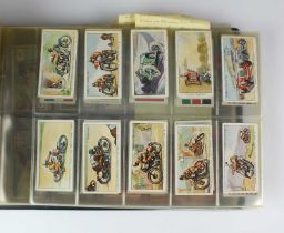 An album containing sets of cigarette cards