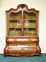 A Dutch walnut, fruitwood and marquetry bombe display cabinet, 19th century