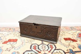 A late 17th century English carved oak bible box