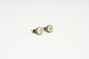 A pair of diamond stud earrings