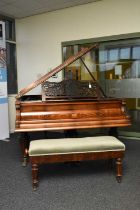 An inlaid rosewood grand piano with piano stool