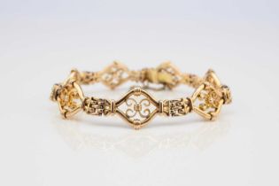 A yellow metal decorative link bracelet