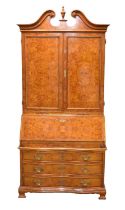 A good reproduction walnut bureau cabinet