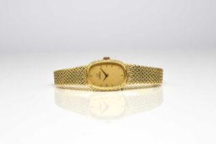 Omega: A lady's 18ct gold bracelet watch